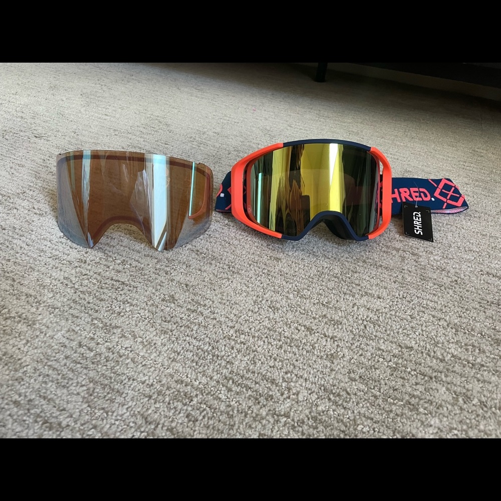 Completely new Shred goggles. Tags and film still attached. Comes with 2 lenses.